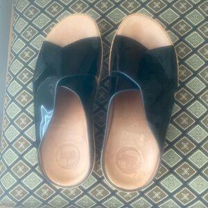 Fit Flop Black patent cross strap sandals